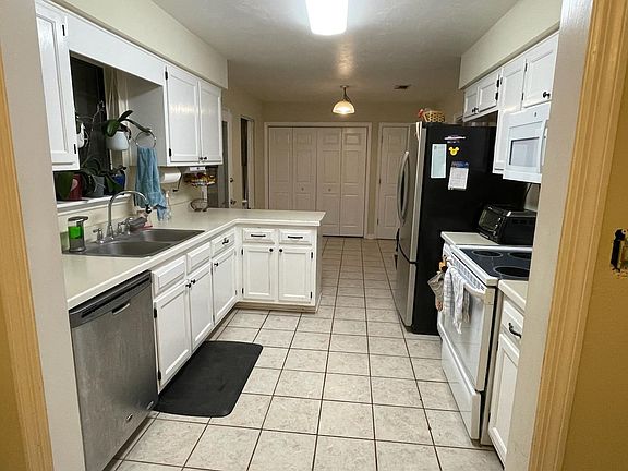 Kitchen, Laundry behind doors on left. Pantry in right door.