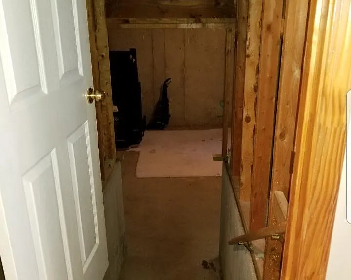 Stairs leading to unfinished sub basement
