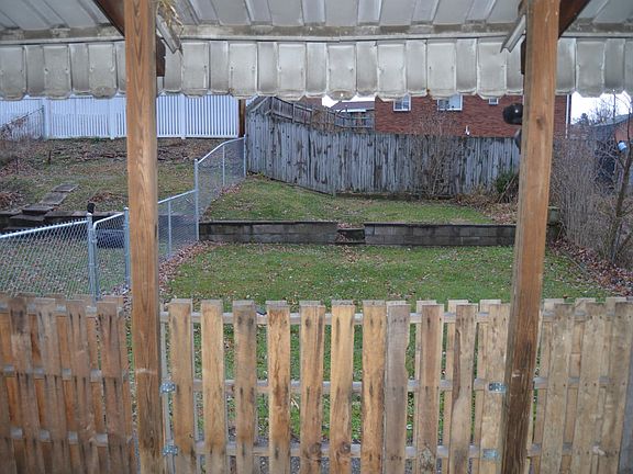 View of the back yard from the covered porch.