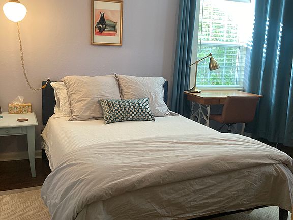 bedroom with tuft and needle queen sized mattress and company store cotton bedding