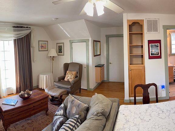 The Living is very cumphy and the door behind the sheer curtains opens to a balcony. We can supply a TV or you can bring yours.