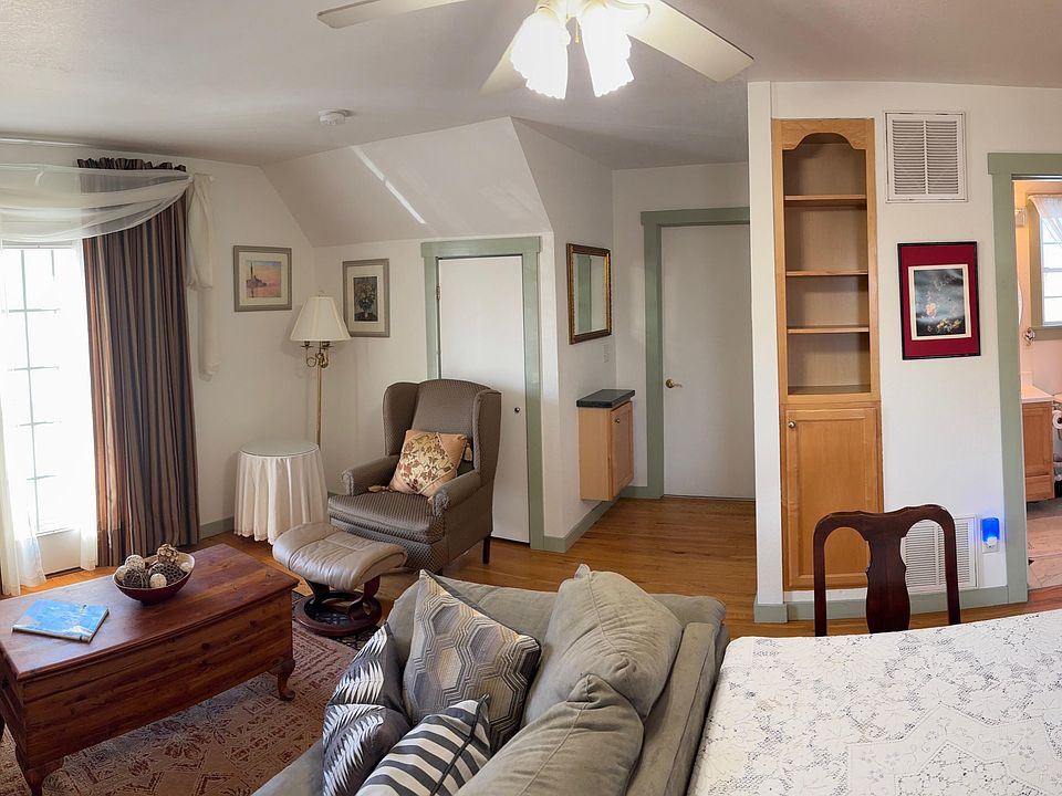 The Living is very cumphy and the door behind the sheer curtains opens to a balcony. We can supply a TV or you can bring yours.