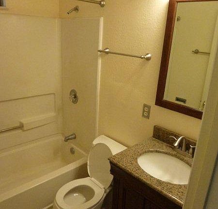 bath with granite vanity