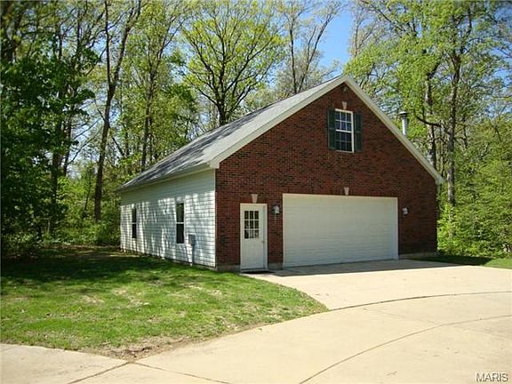 Detached 4 car garage offers space for all of your cars, boats,