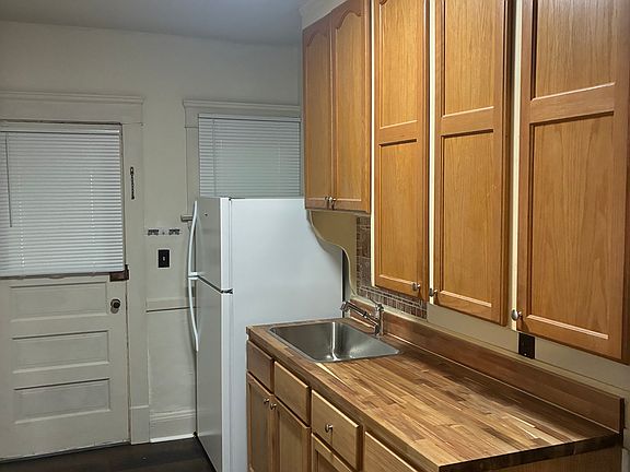 Complete kitchen renovation with new appliances, new stove and refrigerator, and new flooring. Rear entrance to backyard and basement laundry and storage. Washer and dryer included in basement.
