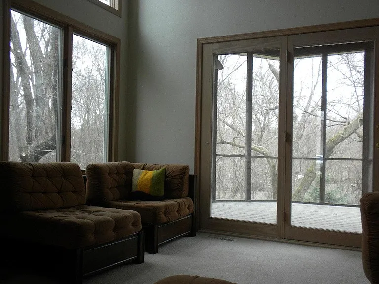 This is the living room looking to the screened-in porch. Th