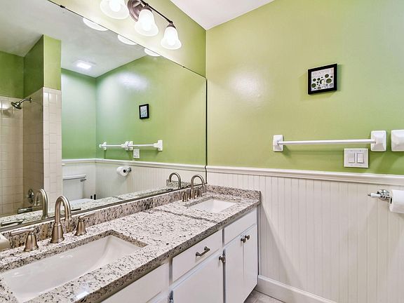 Two sinks with granite counter tops