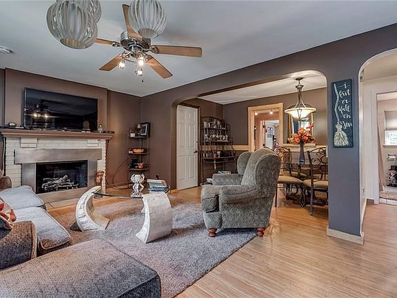 The living room of 6613 with the dining room and the kitchen.  The fireplace works and you can use either gas or wood in it.