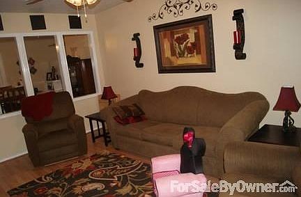 Living area
						:
						Living area opens into dining room. Bay window lets in lots of natural light.