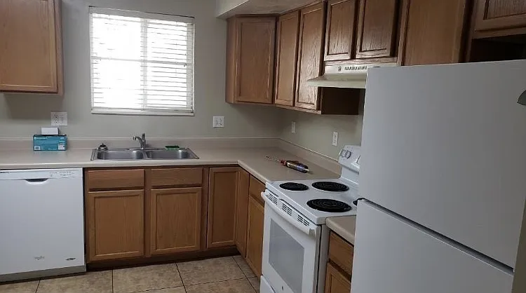 Kitchen includes dishwasher, fridge and stove. W/D hookups are in the closet in the kitchen. Beautiful tile