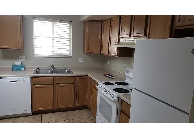 Kitchen includes dishwasher, fridge and stove. W/D hookups are in the closet in the kitchen. Beautiful tile - 1428 W 1650 N #1002