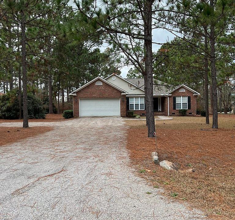 Front Drive and 2 parking spots to left of driveway