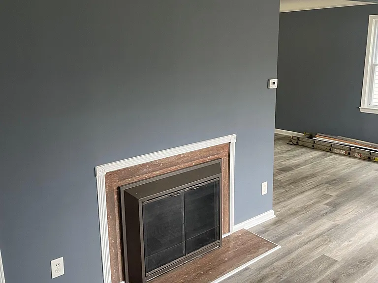 Living room looking towards dining room. Luxury vinyl plank flooring throughout