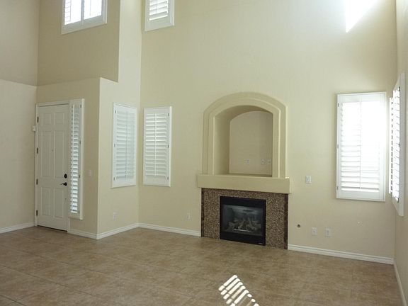 Living Room with fireplace and high vaulted ceiling