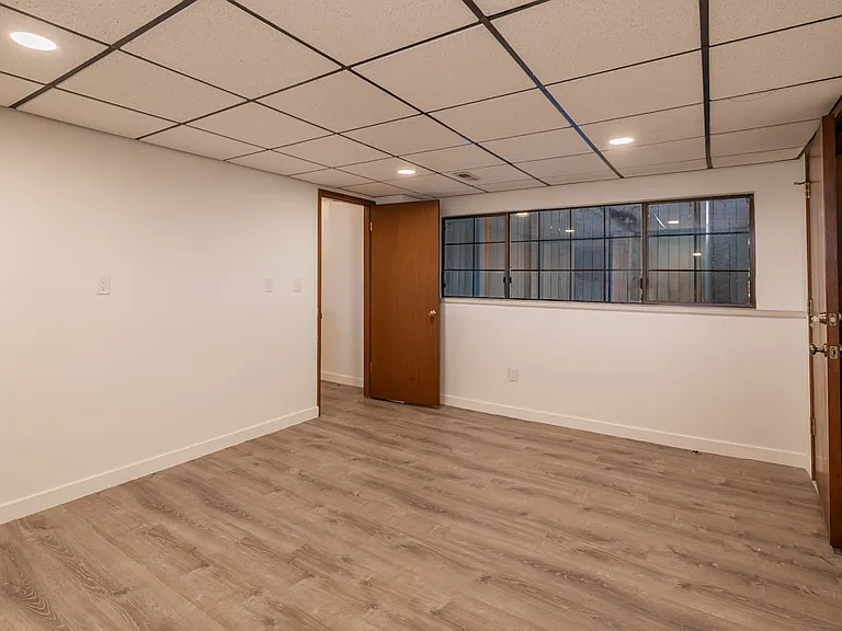 Second bedroom with large garden facing windows
