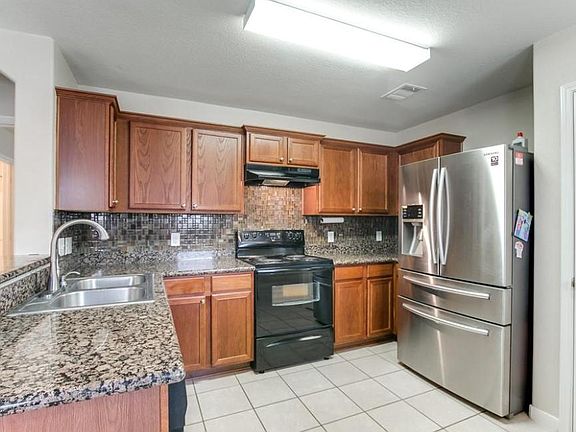 Kitchen from the dining room - the refrigerator is not current. The one in the house now is black.
