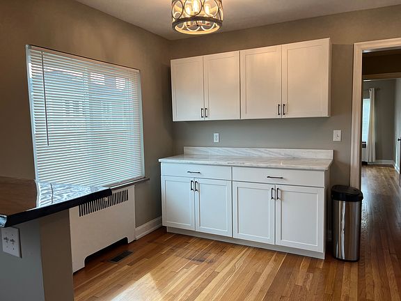 Updated kitchen cabinetry and lighting. Mini-blinds are new throughout.