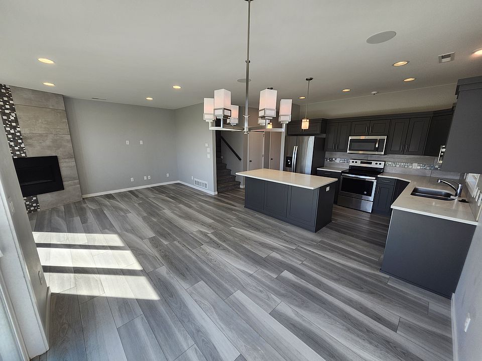 Stunning kitchen with quartz counter tops, stainless steel appliances, soft-close cabinets and more. Photos are of similar unit with same quality of finishes and layout. Color scheme may be different.