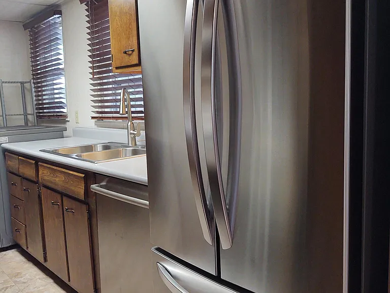kitchen w/newer stainless steel refrigerator