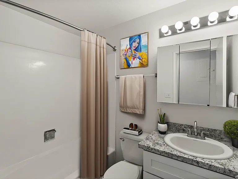Bright Tacoma bathroom with a full tub and modern vanity. Bright Tacoma bathroom with a full tub and modern vanity.