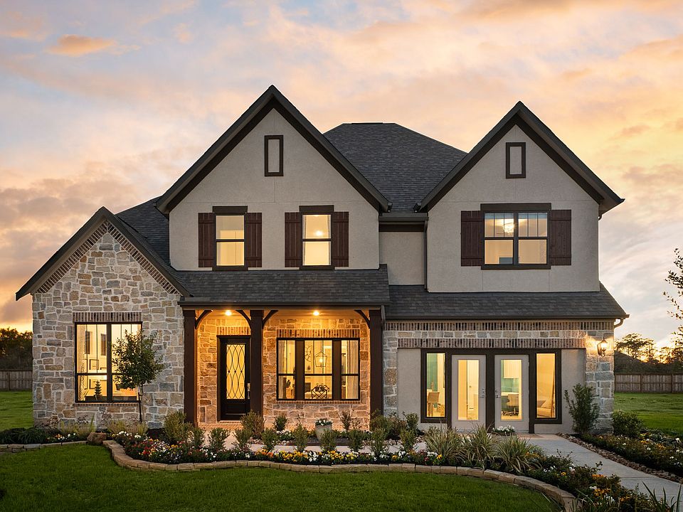 Welcome home to 27114 Velencia Mist Court located in the Northgrove community and zoned to Magnolia