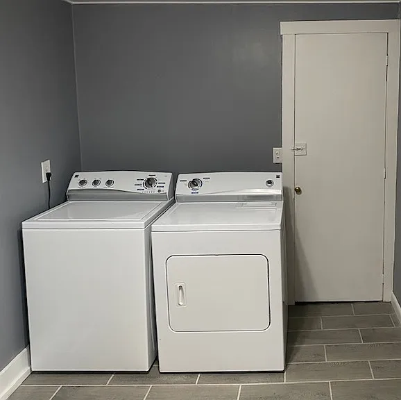 Butler's pantry and laundry area next to kitchen. Washer and dryer included.