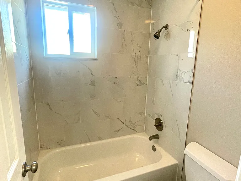 Experience luxury in your private marble-tiled bathroom oasis. Experience luxury in your private marble-tiled bathroom oasis.