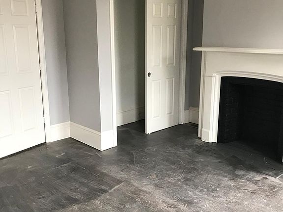 Master Bedroom - fireplace and hardwood floors (will be cleaned before tenants move in)