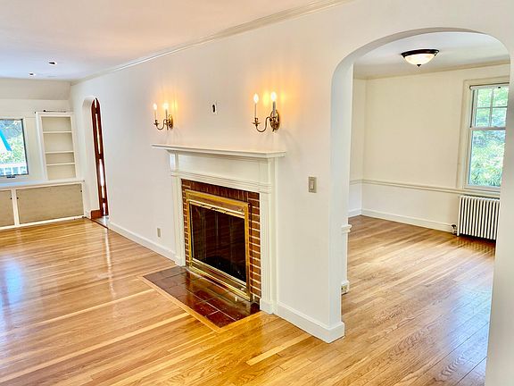 Living room with fireplace and dining room
