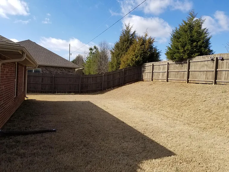 completely fenced and very private backyard
