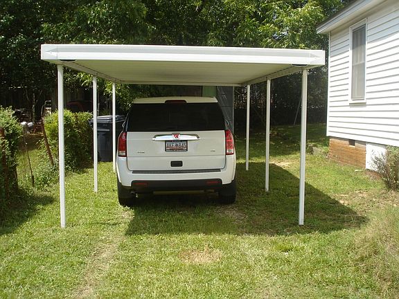 Carport adjacent to house