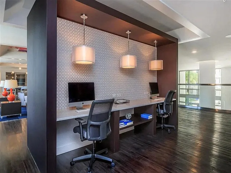 Stay productive in the lounge's dedicated work area, where comfort meets functionality in a bright, open space.