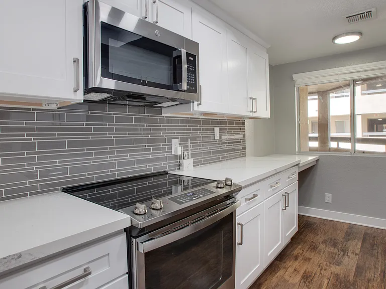 Kitchens with granite countertops and wood flooring