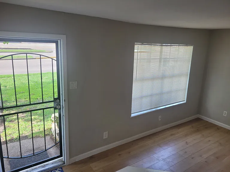 Front entrance and street-facing window of living/main room
