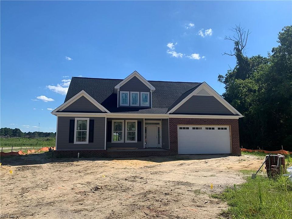  with brick front around garage door.