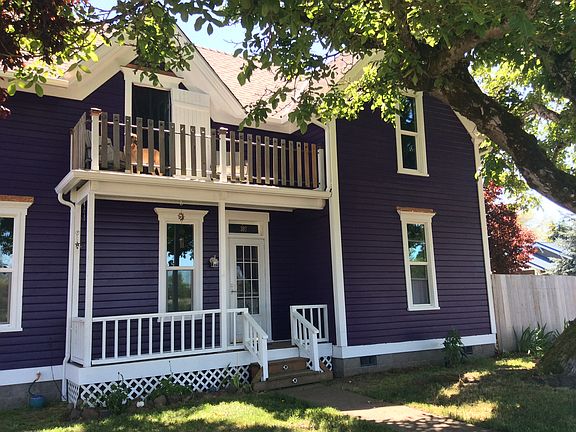 Beautiful English walnut that shades the widows balcony