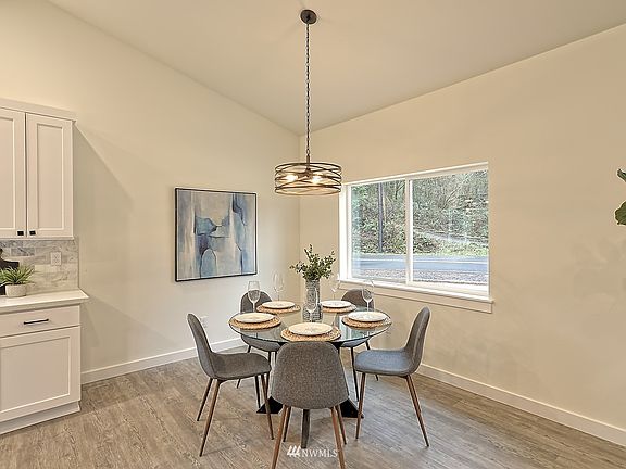 Eating Space off Kitchen. Photos of similar home in subdivision for reference only.>