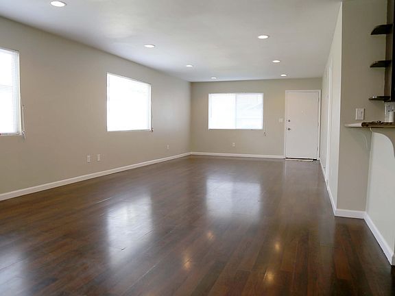 Living Room. Floor will be replaced with brand new vinyl flooring in light color.