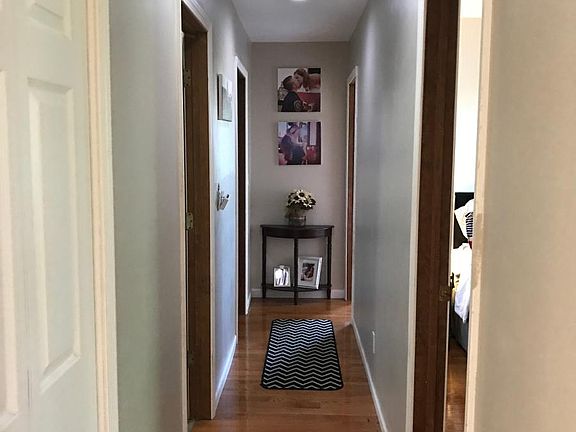 Hallway area with hardwood flooring