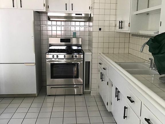 Kitchen includes stove, refrigerator stays but not replaced or repaired