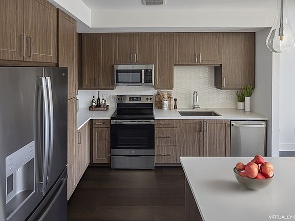 AMLI Branch Park Staged Kitchen WIth Brown Cabinets