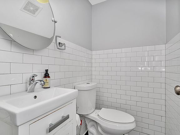 Downstairs half bath, off kitchen