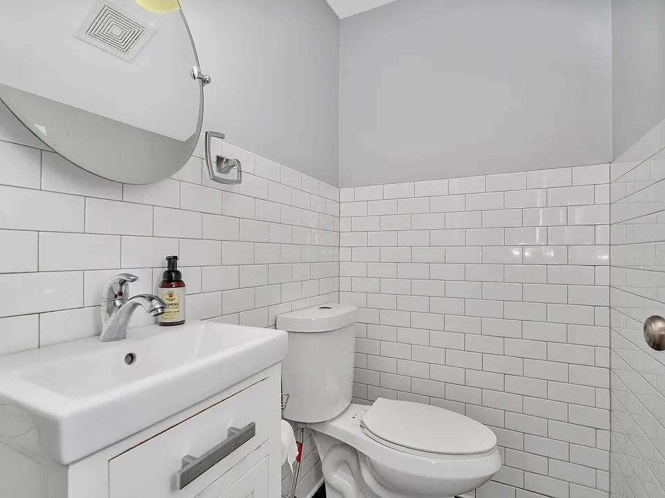 Downstairs half bath, off kitchen