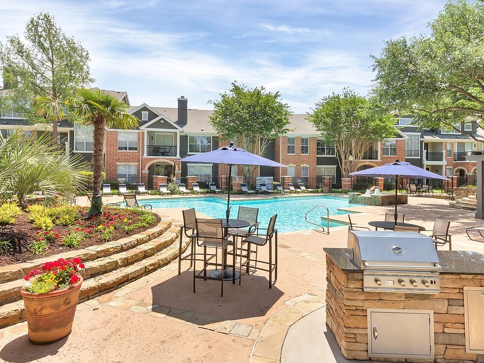 Outdoor entertainment space that's outfitted with a grilling station and abundant seating.