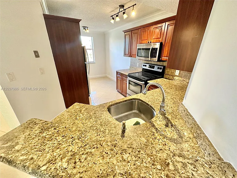 8955 Wiles Rd #208 — Photo 4