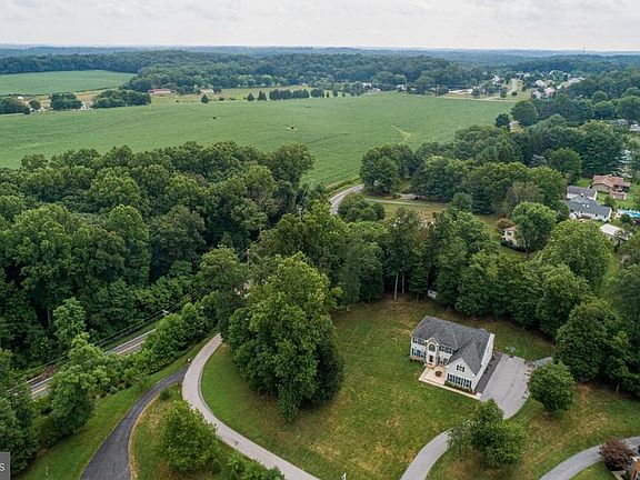 Aerial view of property & surrounding countryside