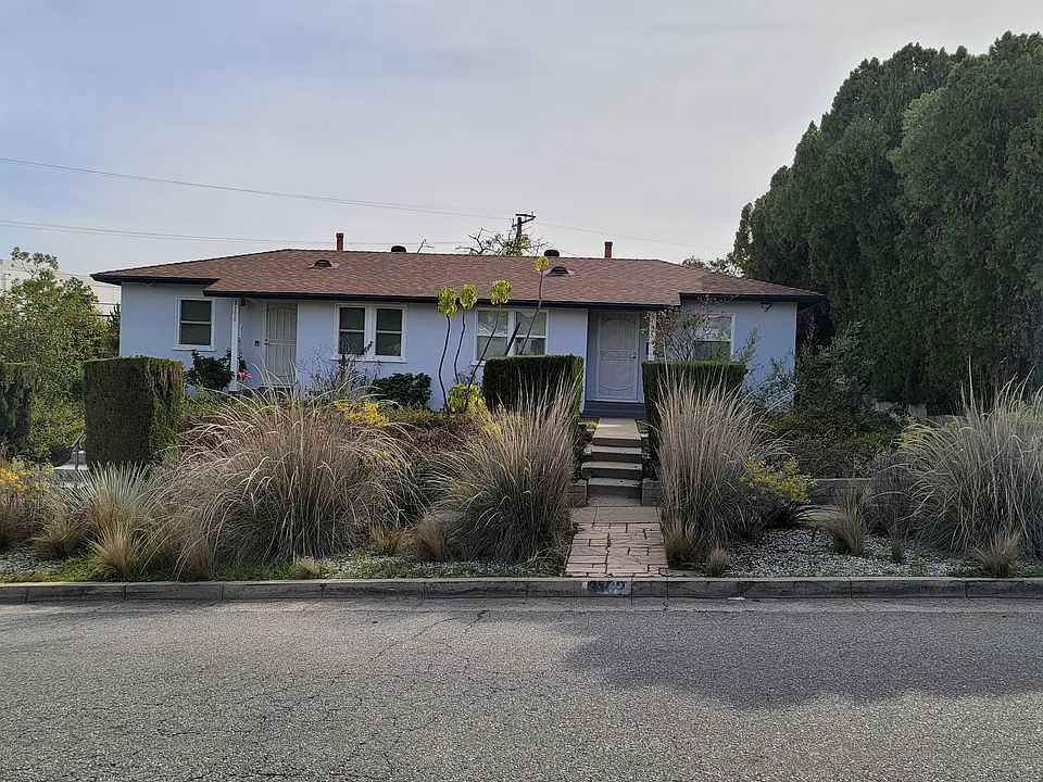 Duplex; two apartments, side by side, a corner lot: 3100 Norwich is on the left.