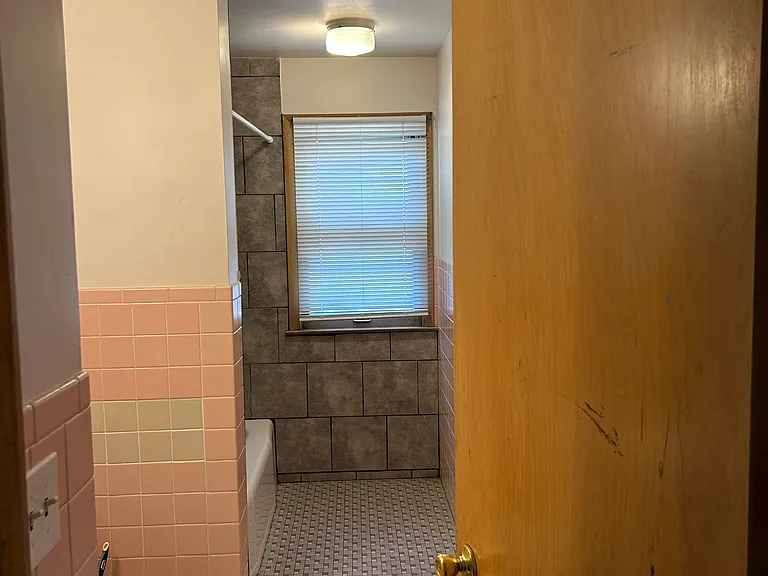 Bathroom has tub and shower