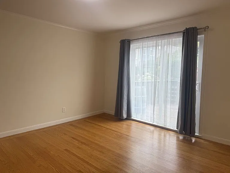 Bedroom #2 with closet and sliding door to the wood deck and stairs lead to the backyard. Monthly rent $1500, Security deposit $1500 plus cleaning fee.