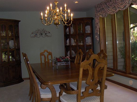 Formal dining room with a wall of windows and great views